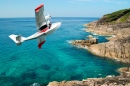 Float Plane Flying over the Beach