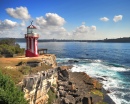 Lighthouse Overlooking the Water