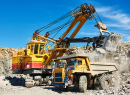 Excavator Loading a Dump Truck