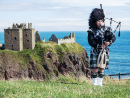 Scottish Bagpiper near Dunnottar Castle